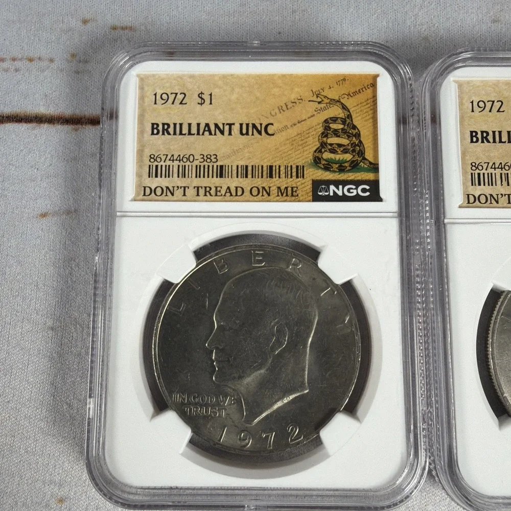 (2) 1972 Eisenhower Dollar Type 1 NGC Brilliant Uncirculated Gadsden Flag Slabs
